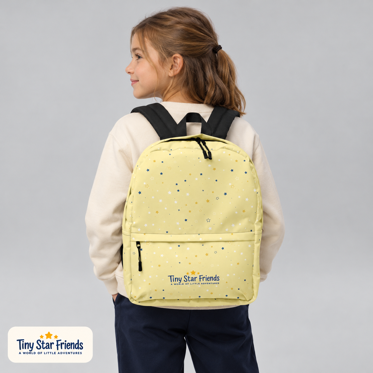 School-age child wearing the Butter Yellow Signature Stars backpack | Tiny Star Friends™